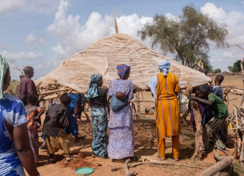 African women building a house