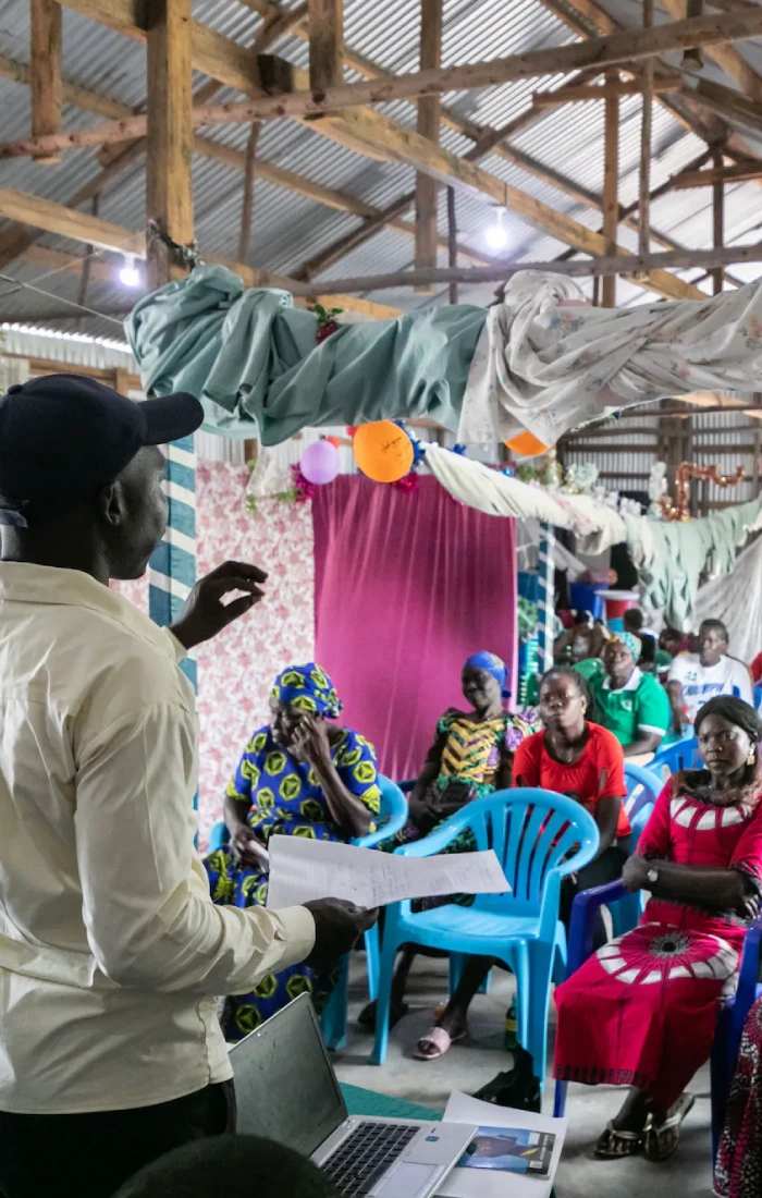 person giving a workshop in an underprivileged area