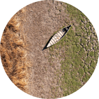 aerial photo of a boat on dry land